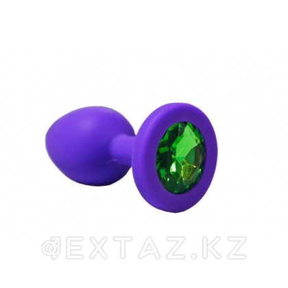 Анальная пробка из фиолетового силикона с зелёным кристаллом (размер S) от sex shop Extaz